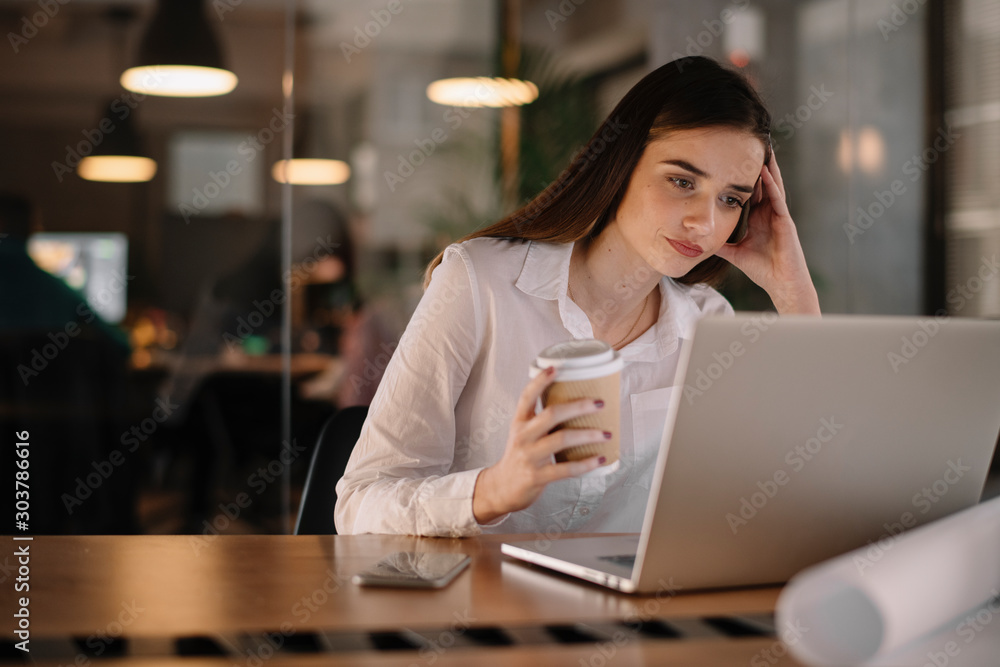 Portrait of tired businesswoman. Young businesswoman working late night