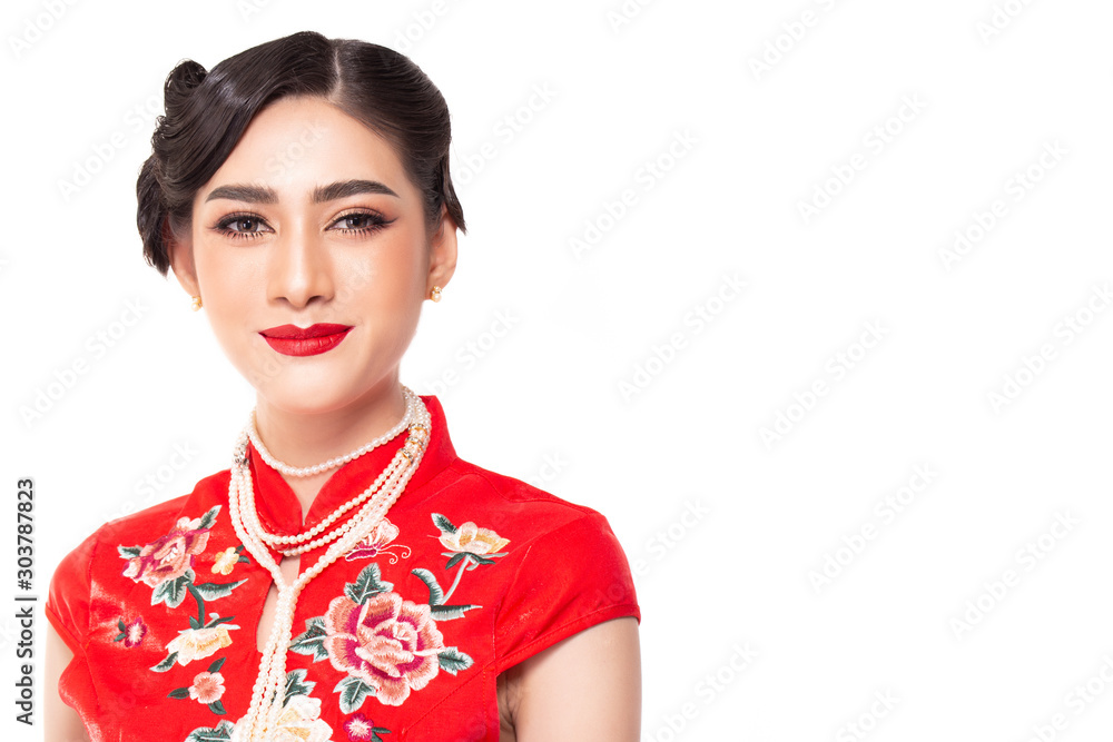 Portrait beauty chinese woman. Beautiful Asia woman wear cheongsam dress on Chinese New Year for celebrating spring festival. Young lady get beautiful make up. Isolated on white background, copy space Portrait beauty chinese woman. Beautiful Asia woman wear cheongsam dress on Chinese New Year for celebrating spring festival. Young lady get beautiful make up. Isolated on white background, copy space