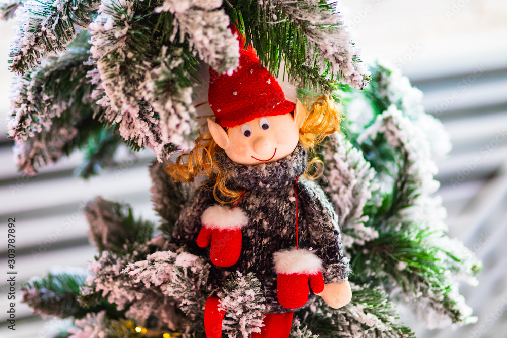 Handmade funny christmas elf toy on the tree