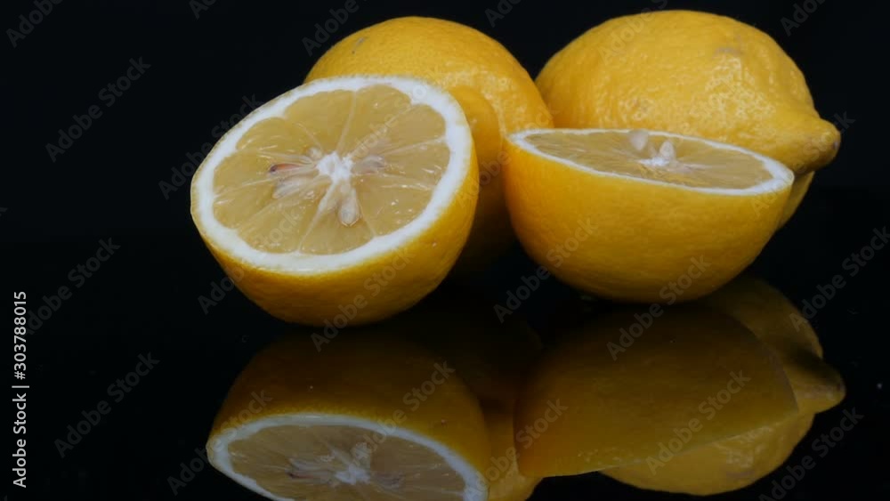 Ripe fresh juicy yellow lemon on a black background Ripe fresh juicy yellow lemon on a black background