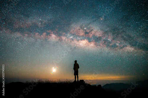 Landscape with Milky way, Milky way background, Night sky with stars and galaxy over night sky and silhouette of a standing people in Thailand