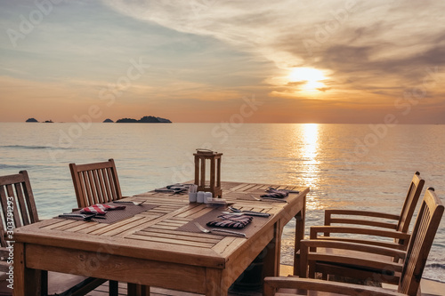 Outdoor cafe on the beach during sunset on Koh Chang island  Thailand.