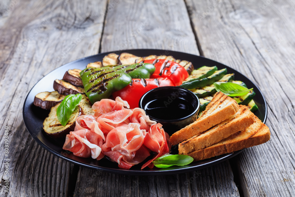 sliced prosciutto ham served with grilled veggies sliced prosciutto ham served with grilled veggies