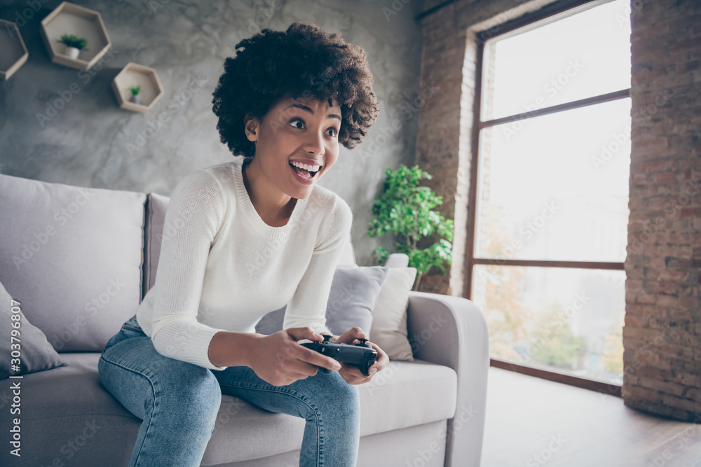 Φωτογραφία Photo of funny dark skin curly lady playing video games addicted want winning ho
