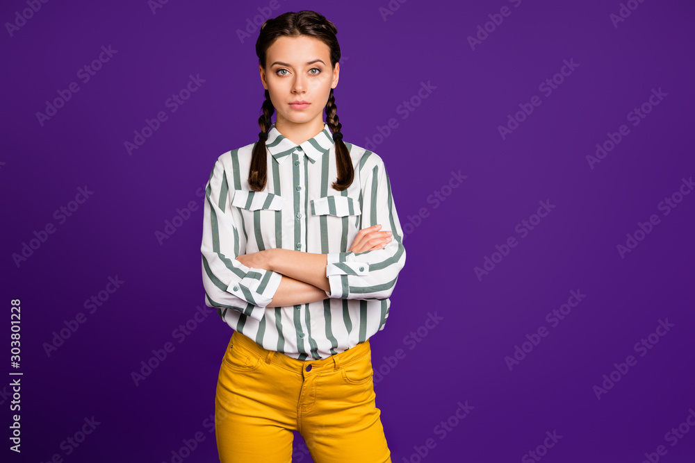 Photo of beautiful business lady holding hands crossed responsible person seriously looking colleagues wear striped shirt yellow trousers isolated purple color background Photo of beautiful business lady holding hands crossed responsible person seriously looking colleagues wear striped shirt yellow trousers isolated purple color background