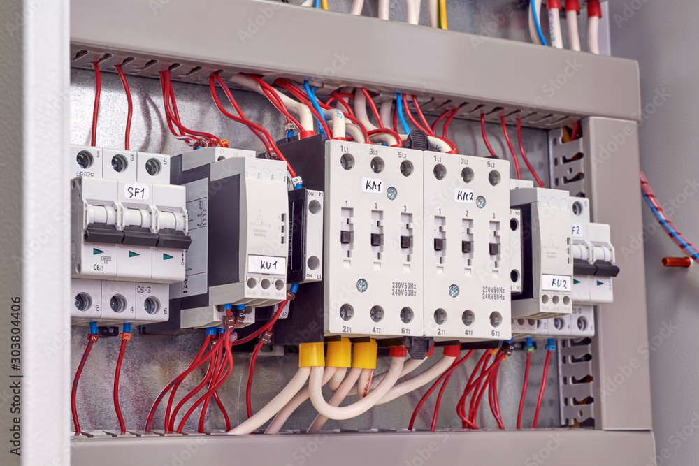 Fotografía Two power electrical contactors, phase control relays and circuit breakers in the electrical Cabinet