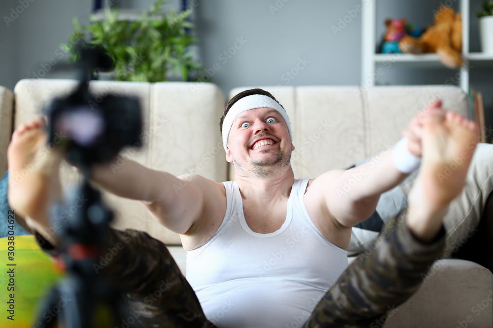 Fototapeta premium Vlogger freak shows his subscribers on camera