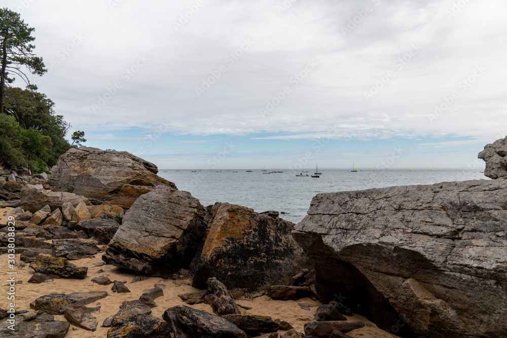 Noirmoutier sand beach large block stone in vendee