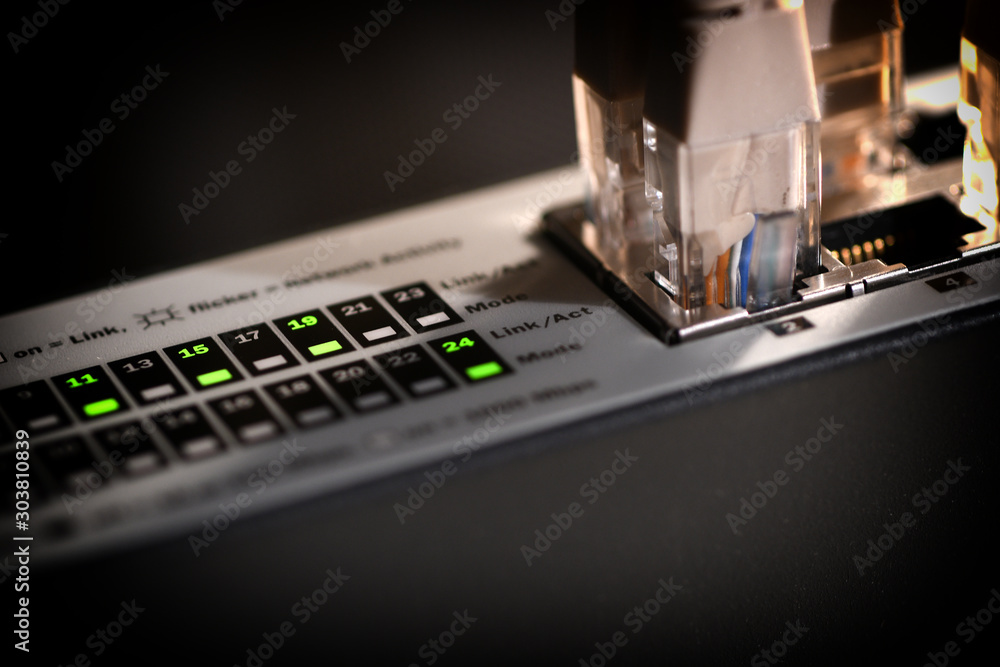 Detail of lights on Network switch and cables rj45. Data