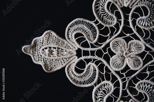 Beautifully shaped laces on black. © belyaaa