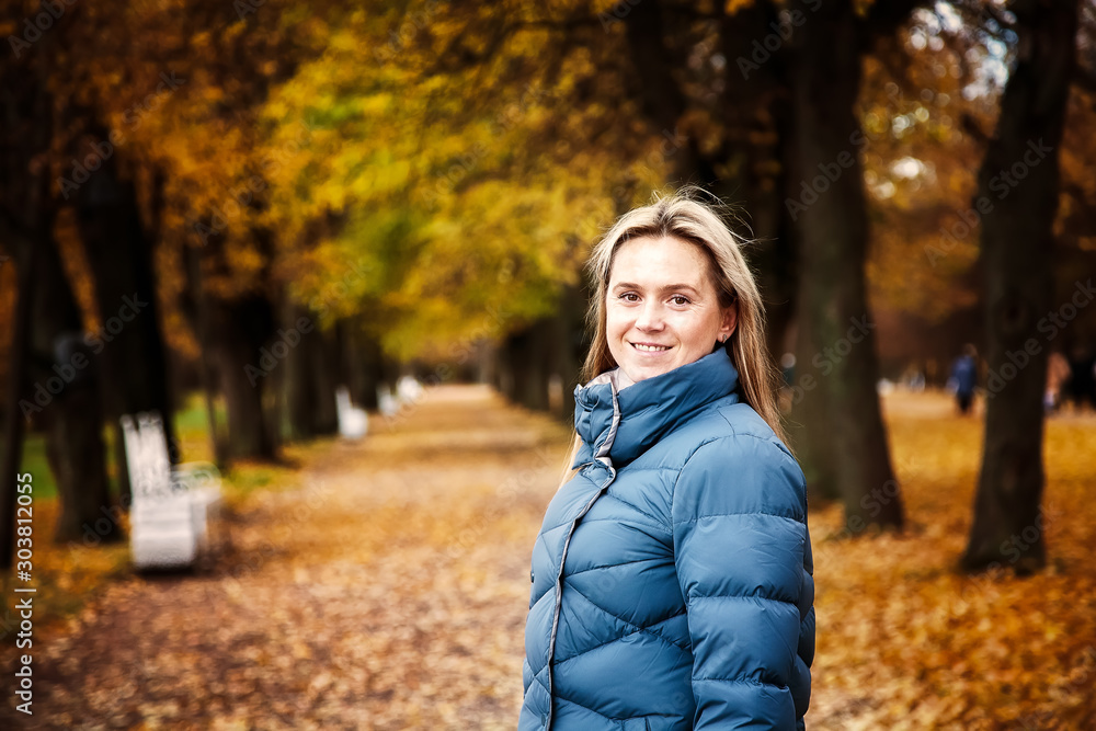 A woman walks in the autumn Park A woman walks in the autumn Park