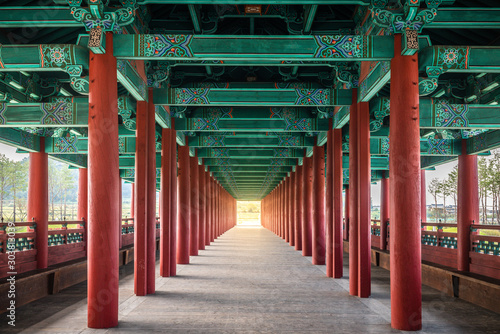 Woljeonggyo covered bridge with perfectly aligned red colonnade Gyeongju South Korea photo