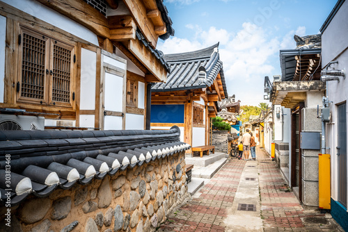 Laneway in Gyeongju with old Korean houses and dramatic light Gyeongju South Korea photo