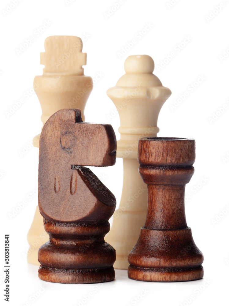 White and brown wooden chess pieces on white background White and brown wooden chess pieces on white background