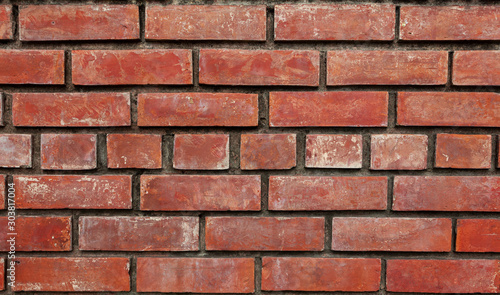 Old brick wall  old texture of red stone blocks closeup