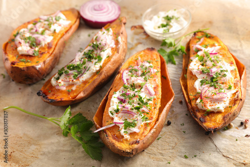 baked sweet potato with cream and herbs