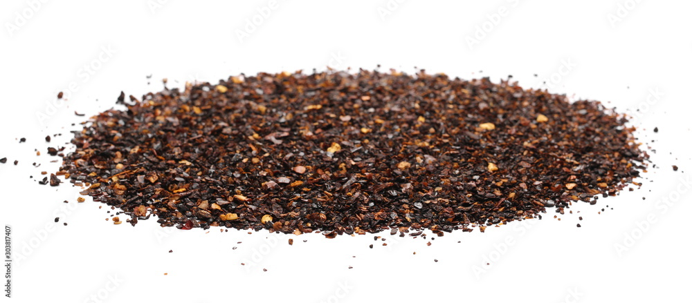 Roasted ground dry chili pepper pile, spicy chopped paprika isolated on white background Roasted ground dry chili pepper pile, spicy chopped paprika isolated on white background