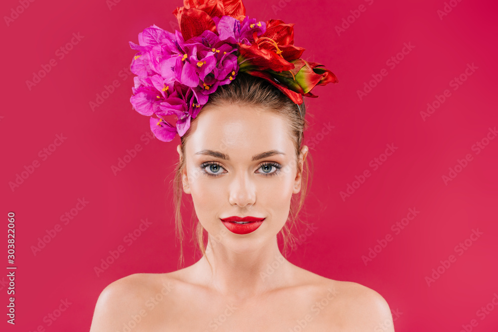 naked beautiful woman with red lips and floral wreath on head isolated on crimson