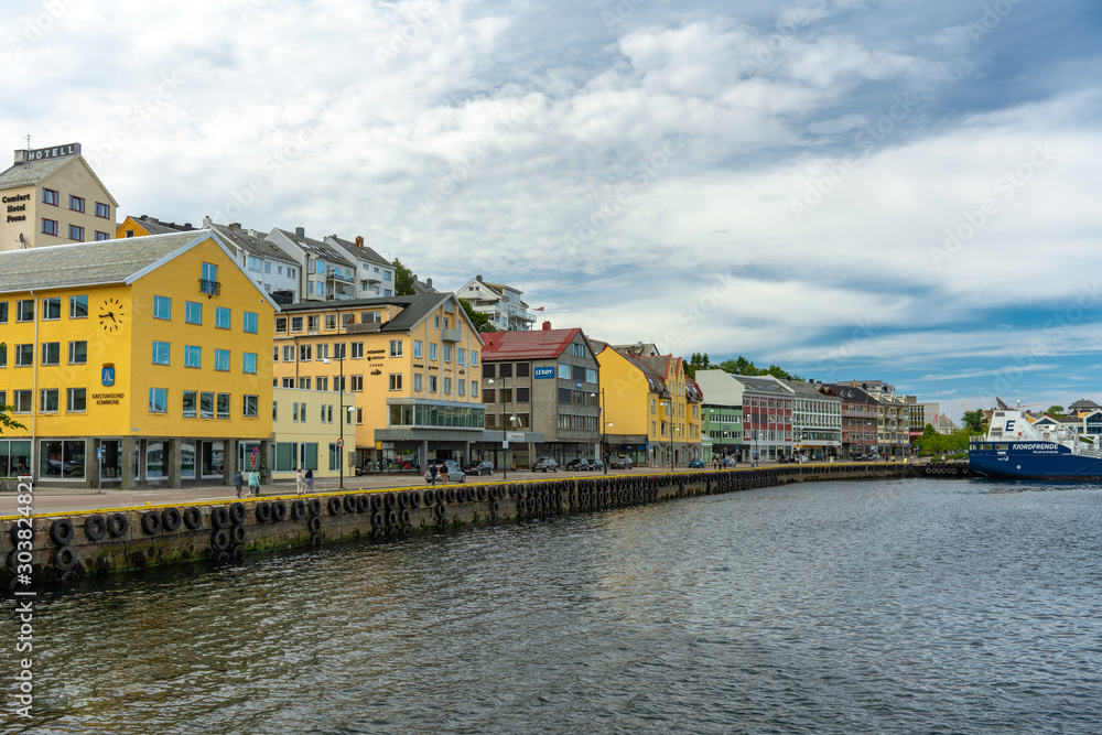 The main street and buildings with boat dock in Kristiansund Norway