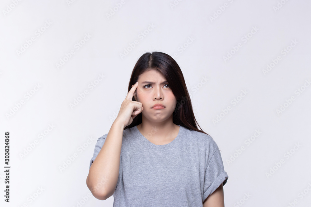 Attractive beautiful asian young woman thinking and looking upwards on white background. Attractive beautiful asian young woman thinking and looking upwards on white background.