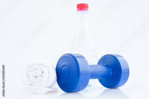 Blue plastic coated dumbells And Water Bottle isolated on white