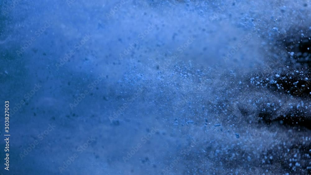 Super Slowmotion Shot of Side Blue Powder Explosion Isolated on Black Background at 1000fps. Super Slowmotion Shot of Side Blue Powder Explosion Isolated on Black Background at 1000fps.