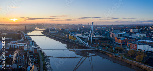 An aerial view at sunrise of Newport city centre, south wales United Kingdom, taken from the River Usk photo