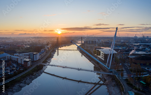 An aerial view at sunrise of Newport city centre, south wales United Kingdom, taken from the River Usk
