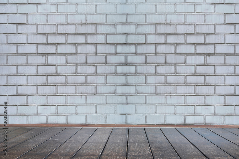 Background of aged grungy textured white brick and stone wall with light wooden floor with whiteboard inside old