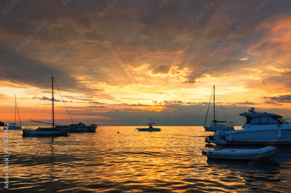 Sunset at boat marina with dramatic sky