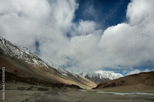 View landscape with Himalayas mountains and Pangong Tso high grassland lake while winter season for indian and tibetan and foreigner travelers travel visit at Leh Ladakh in Jammu and Kashmir, India © tuayai