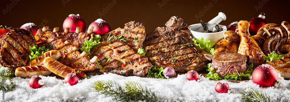 Fresh grilled meat decorated with snow - obrazy, fototapety, plakaty 