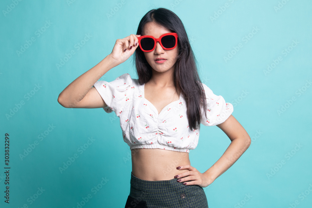 Portrait of a beautiful young asian girl in sunglasses