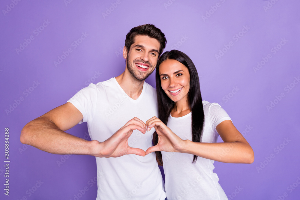 Close-up portrait of his he her she nice attractive lovely charming lovable cheerful cheery couple showing heart gesture love forever isolated on purple violet lilac color pastel background Close-up portrait of his he her she nice attractive lovely charming lovable cheerful cheery couple showing heart gesture love forever isolated on purple violet lilac color pastel background