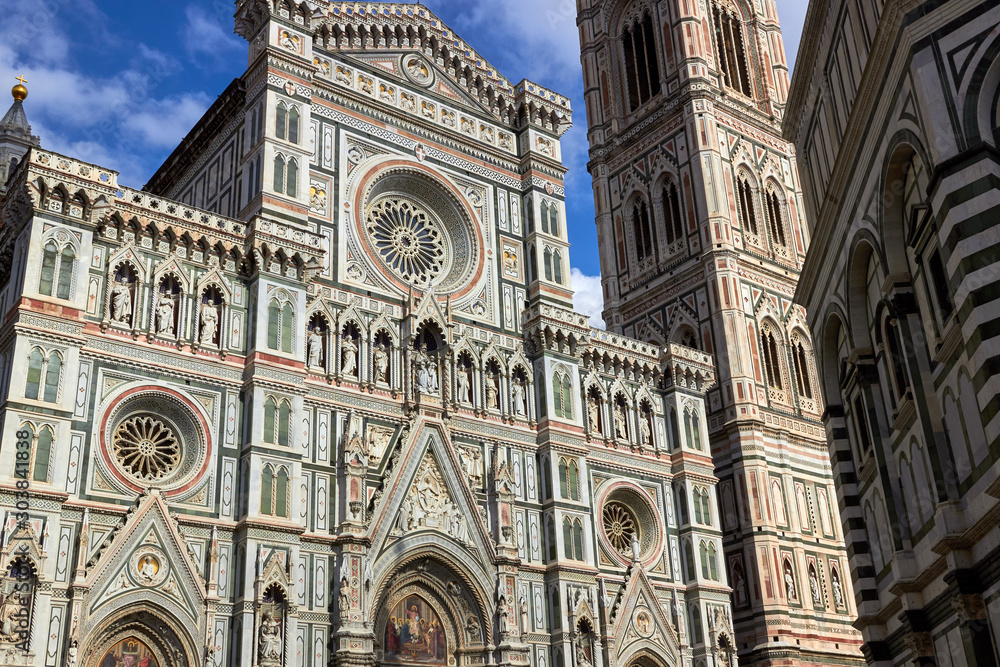 Detail of the facade of the Basilica di Santa Maria del Fiore (Florence Cathedral or Cathedral of Saint Mary of the flower), the main church of Florence, Italy. Bottom view.