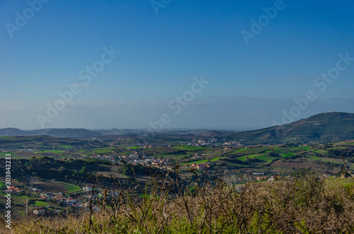 Beautiful view of the fields and city in Portugal  panorama. Sky with clouds. Place for text.