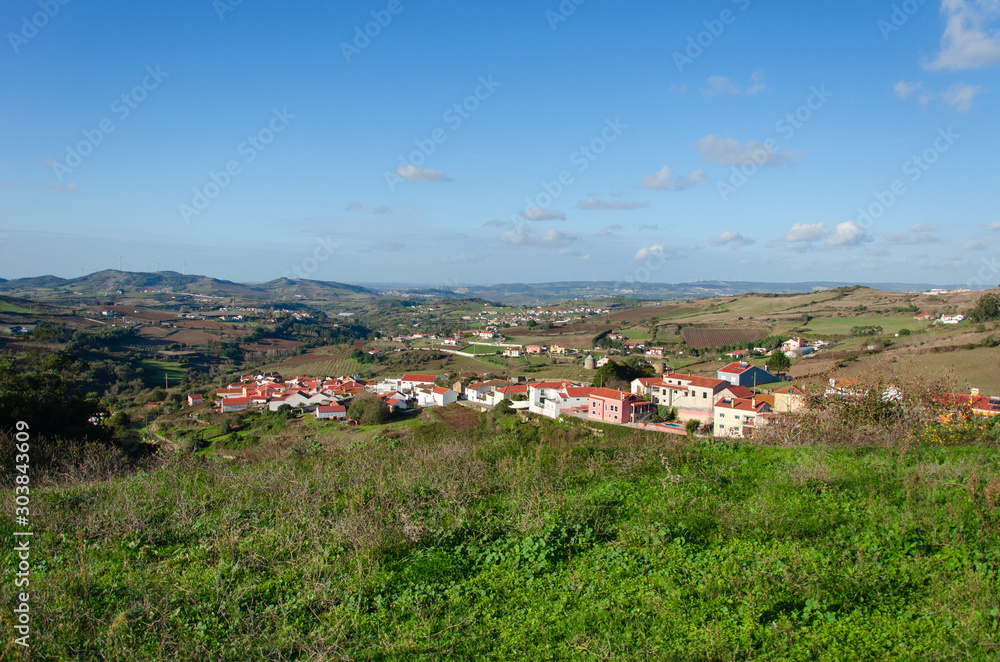 Beautiful view of the fields and city in Portugal, panorama. Sky with clouds. Place for text.
