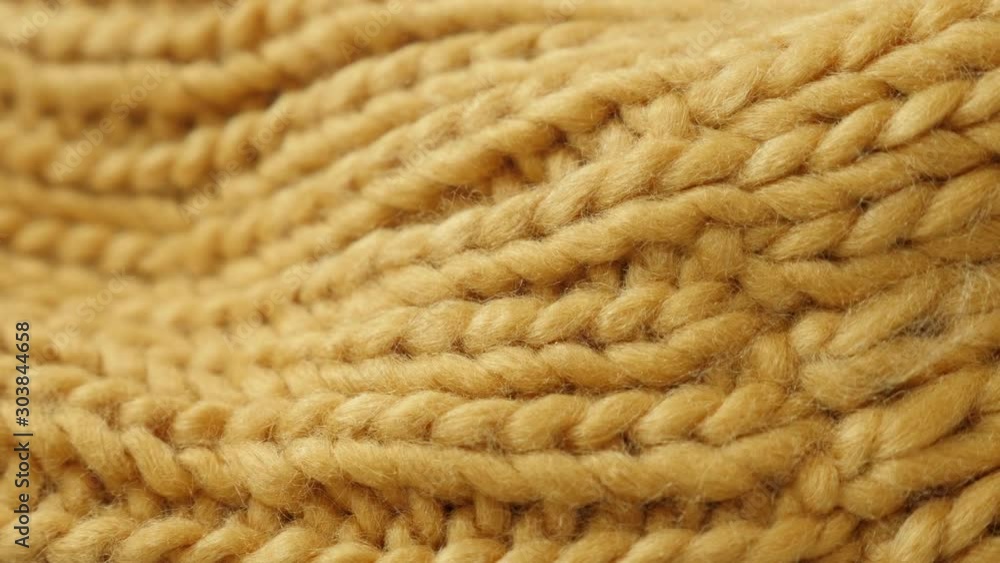 Panning over the yarn made fabric in yellow color 4K video Panning over the yarn made fabric in yellow color 4K video