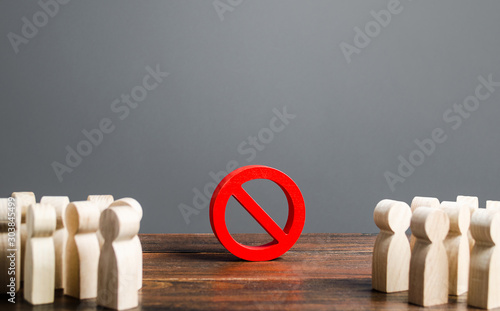 Photos People looking at red prohibition sign NO