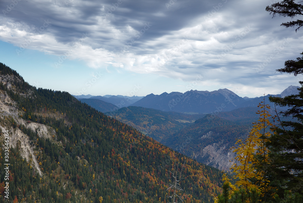 NB__9780 Clouds above mountain range with forest in autumn