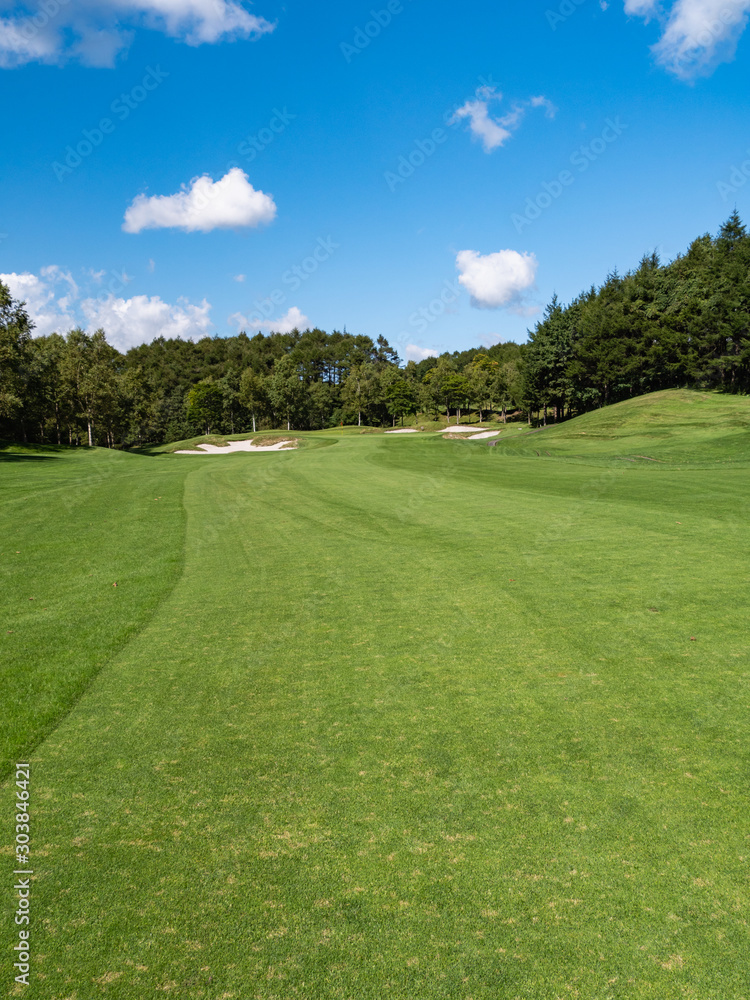 Golf Course with beautiful green field. Golf course with a rich green turf beautiful scenery.