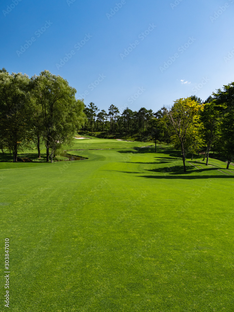 Golf Course with beautiful green field. Golf course with a rich green turf beautiful scenery.