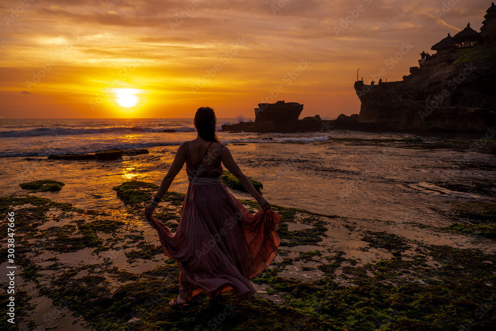 Woman against Pura Tanah Lot temple , Bali Woman against Pura Tanah Lot temple , Bali