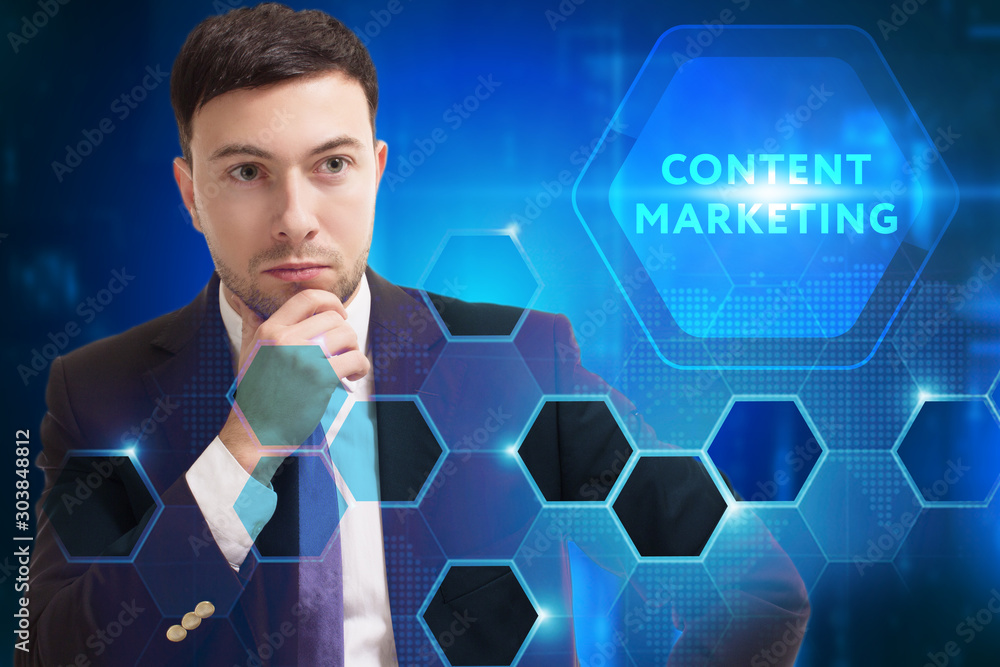 Business, Technology, Internet and network concept. Young businessman working on a virtual screen of the future and sees the inscription: Content marketing Business, Technology, Internet and network concept. Young businessman working on a virtual screen of the future and sees the inscription: Content marketing