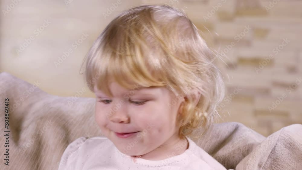 Portrait of a little beautiful blond girl indoors Portrait of a little beautiful blond girl indoors