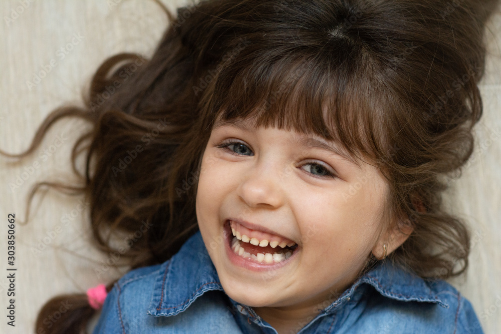 Toddler Girl With Brown Hair And Blue Eyes