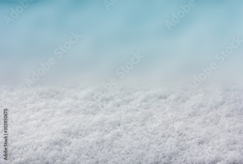 Winter Christmas new year background with lying snow. Background for design with copy space