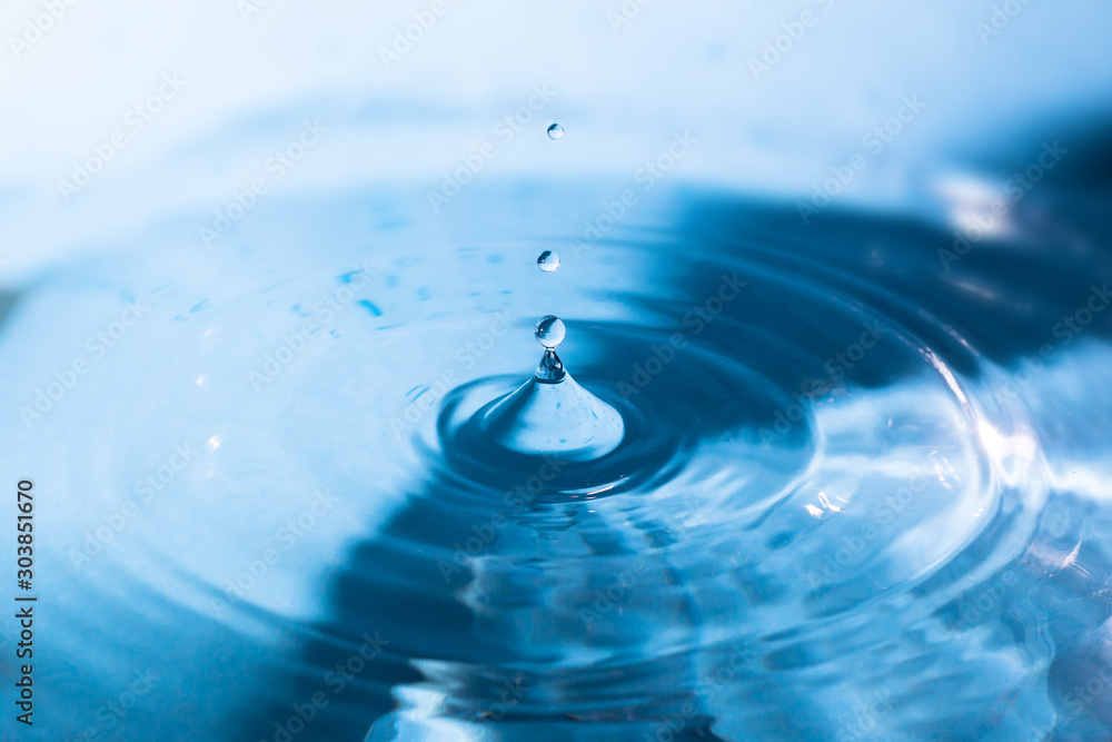 Water splash close-up. Crown of blue water. Water drop. Aqua background Water splash close-up. Crown of blue water. Water drop. Aqua background