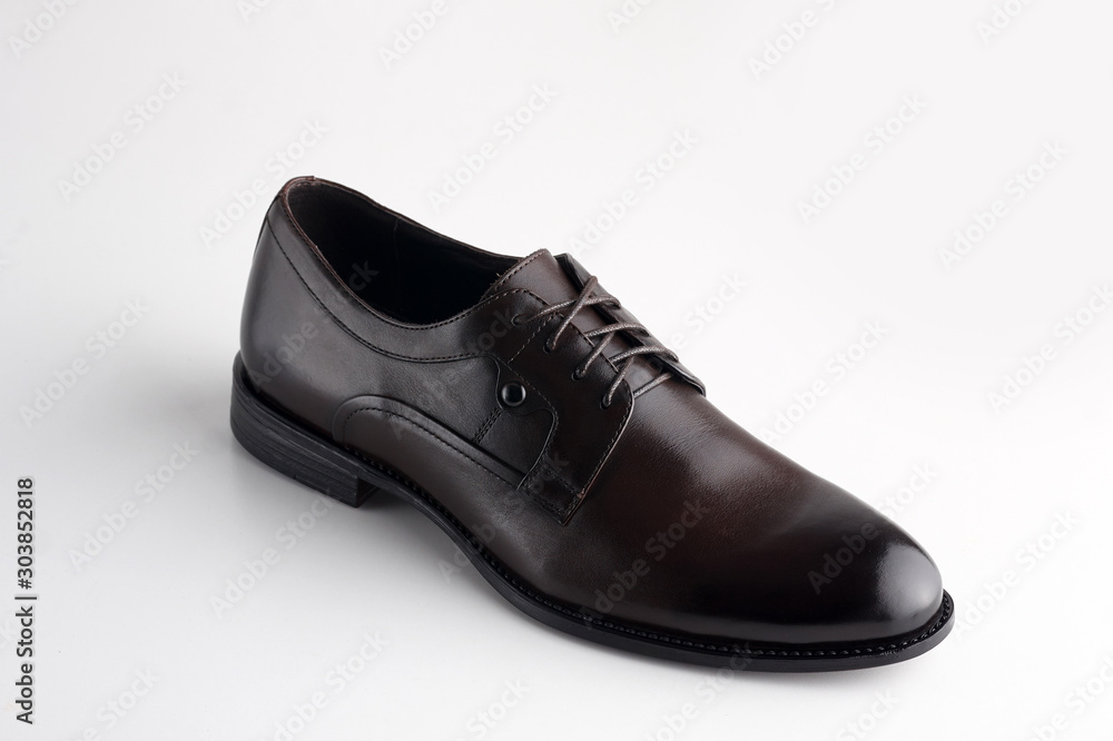 Black men leather shoe with shoelaces on white background Black men leather shoe with shoelaces on white background