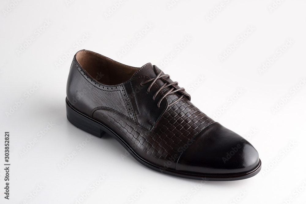 Black men leather shoe with shoelaces on white background Black men leather shoe with shoelaces on white background
